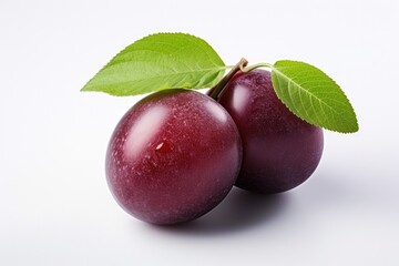 Obraz premium Juicy purple Plum fruits with green leaf isolated on white background