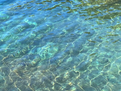 Sea water clear blue turquoise surface.