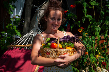 woman farmer with vegetable harvest. organic food and eco farming. greengrocer woman outdoor....