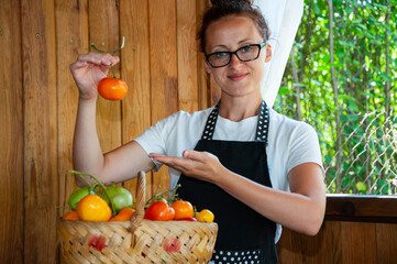 woman farmer with vegetable harvest. organic food and eco farming. greengrocer woman outdoor....