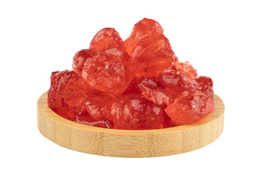 red rock candy-berlingot in a wooden bowl