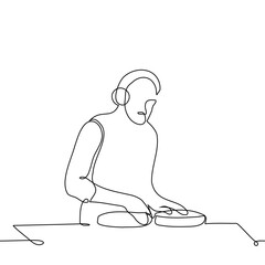 male dj in overhead headphones at dj console - one line art vector. concept dj in the process of work