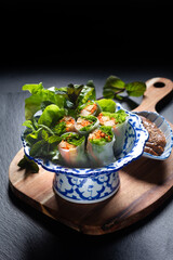 Healthy food concept Homemade vegan Tofu summer rolls or spring roll with peanut dipping sauce on...