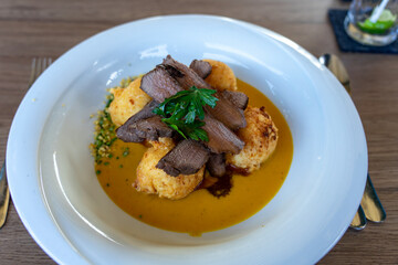 hungarian game dish called vadas style deer with potato dumpling