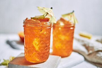 orange juice and oranges on white background