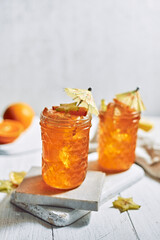 orange juice and oranges on white background