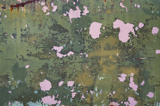 Background  Texture of splintered rotten camouflage paint on a ww2 american military vehicle