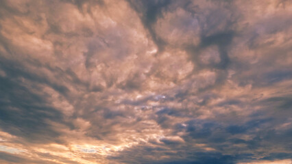 Naklejka na ściany i meble beautiful sundown golden clouds on the sky background - photo of nature