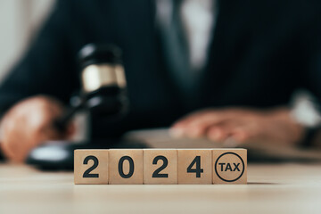 Tax 2024 on wooden blocks. Business and tax concept. Financial calculation, tax, accounting,...