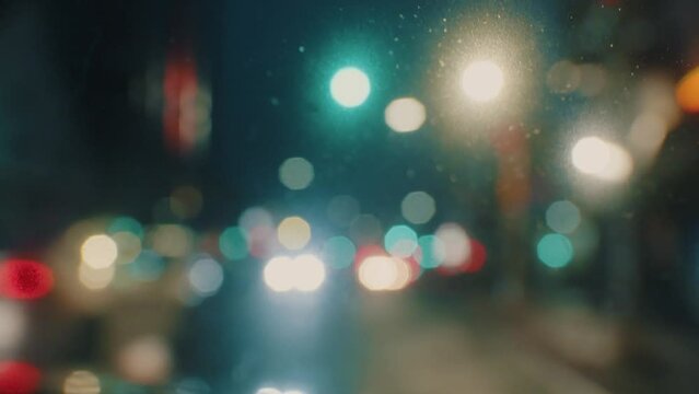 View from the front window of the car on the city at night with lights from the headlights of cars and city lights in blur.Car Driving Highway Many Lights Cars Overtaking Other Vehicles Night City 