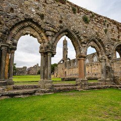 Fototapeta premium Medieval stone arches at the ruined cathedral of St Andrews in Scotland.