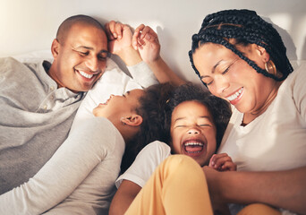 Family, bed and laughing in morning in happy home while playing, tickle or bonding with love....