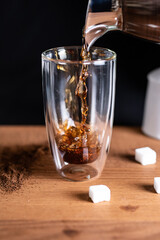 coffee being poured in a glass