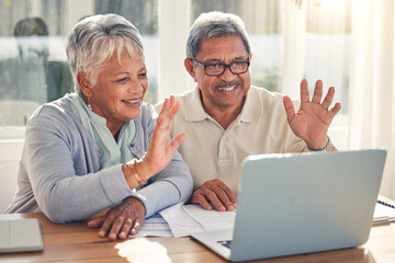 Senior couple, laptop and hello in video call, virtual meeting or communication together at home. Happy mature man or woman waving or talking on computer in online conversation or discussion in house