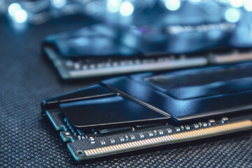 DDR4 DRAM memory modules in blue bright light. Computer RAM chipset close-up. Desktop PC hardware...