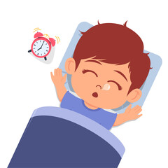 Cute boy is sleeping soundly and the alarm is ringing