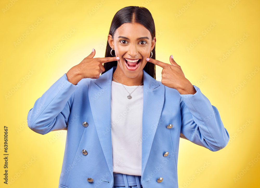 Sticker Fingers on cheek, portrait and a happy woman in studio for positive attitude, dimples and emoji. Indian model person or student with fashion, comic and excited face or silly mood on yellow background