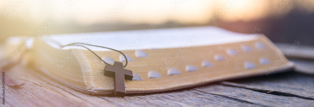 Wall mural wooden cross on the book