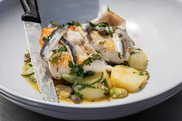 Cod and Whitebait dish with knife