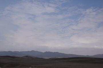 Fototapeta na wymiar Pretty sky in peru desert next to road