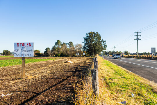 Sign protesting forced land acquisition for Singleton Bypass