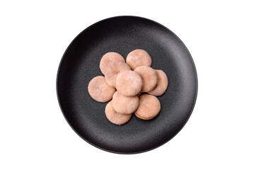 Delicious fresh baked cornmeal shortcakes or cookies on a black plate