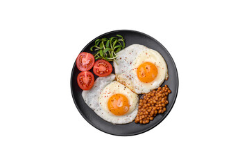 Delicious hearty breakfast consisting of two fried eggs, canned lentils and microgreens