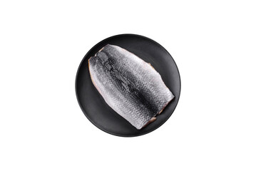 Delicious salted herring fillet in oil on a black ceramic plate