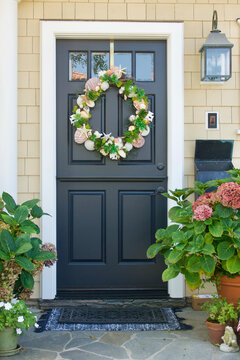 vintage bungalow with seashell wreath on the front door