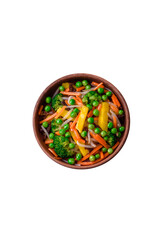 Delicious steamed vegetables broccoli, mushrooms, peas, carrots and onions