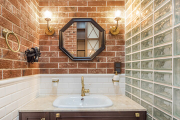 xclusive design of the bathroom with a brick tile finish. Stylish accessories. The shower .is...