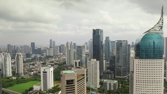 day time jakarta city downtown district traffic street construction yard aerial panorama 4k timelapse indonesia