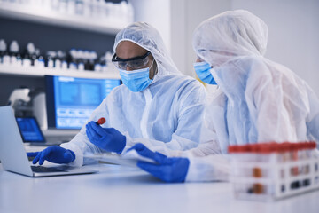 Laptop, science and blood sample with a research team in a laboratory for research or innovation....