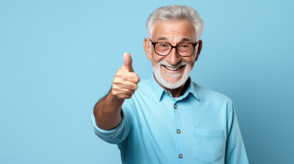 Senior man standing over isolated blue background doing happy thumbs up gesture with hand. - Powered by Adobe