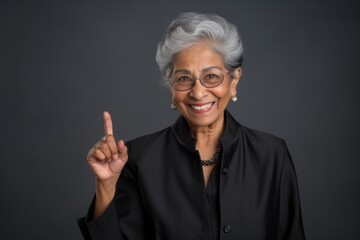 Old business woman glasses white hair in happy expression on studio shoot grey background, portrait photo 