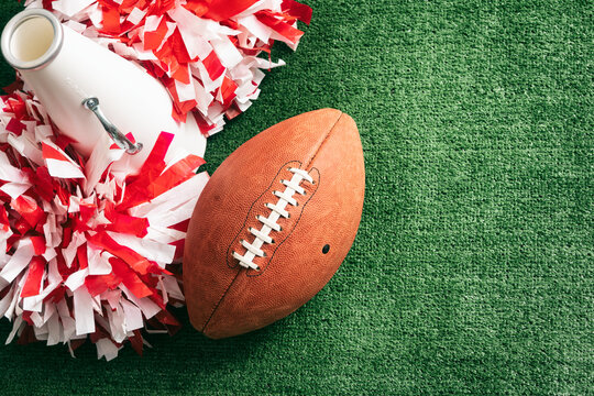 Sports: Cheerleader Megaphone And Poms With Football