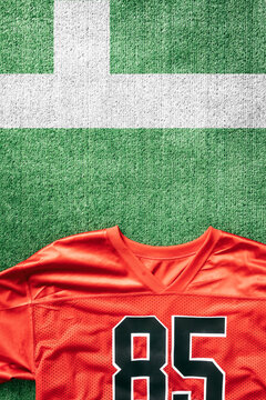 Sports: Football Uniform On Field Near Stripes