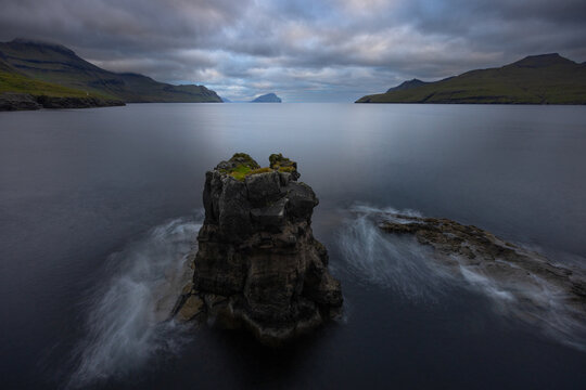 Sea stack at sunset, near Leynar, Faroe Islands