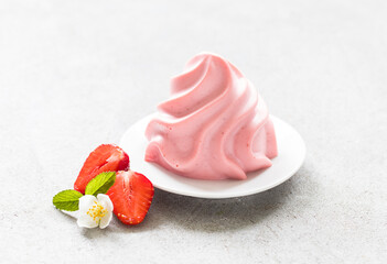 Strawberry cream pudding,  Panna Cotta in the form of French Chantilly cream, on a plate. Light...
