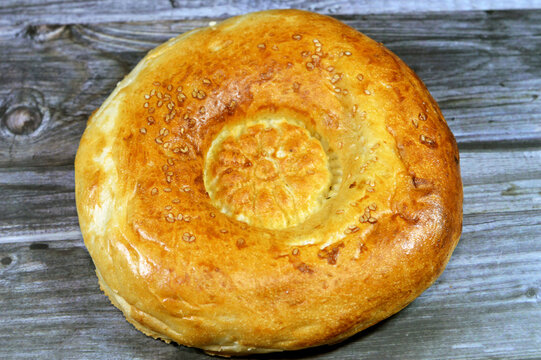 Tandyr nan Uzbek bread, a type of Central Asian bread, often decorated by stamping patterns on the dough by using a bread stamp known as a chekich, also called tamdyr &ccedil;&ouml;rek, tonur nan, tandir non