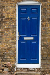 A blue door with a door step