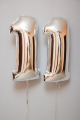 silver balloons number 11 on white background