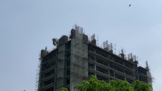 Workers are working at the construction site of the building. People are working on the building.  under construction, High rise building construction. F10 Markaz Islamabad Pakistan 18 August 2023