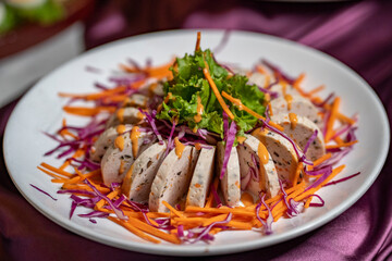 Spicy Vietnamese sausage salad Yum Moo Yor, Thai food style. Steamed Pork or Moo Yor and Vegetable. (Vietnamese-style Sausage)