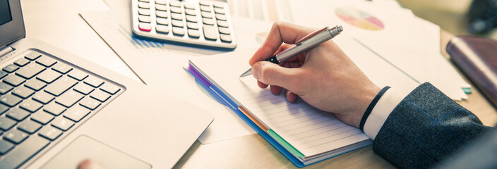 man hand notepad in working desk