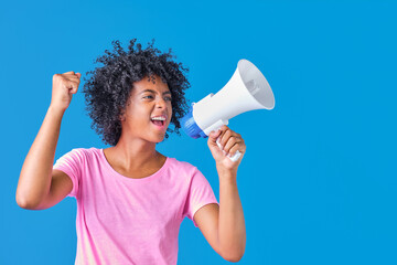 african american girl in a pink t-shirt with a megaphone in her hand protesting on a blue background