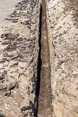 Long trench for laying water supply and sewage system pipes