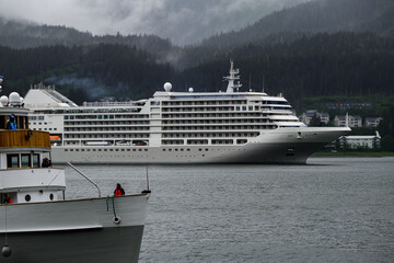 Luxury Silver cruiseship cruise ship liner Muse arrival into port of Juneau, Alaska during nature...