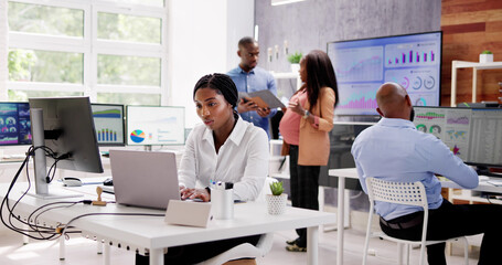 African Financial Data Analysts Using Dashboard On Screens