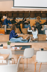 Diverse group of people discussing while waiting